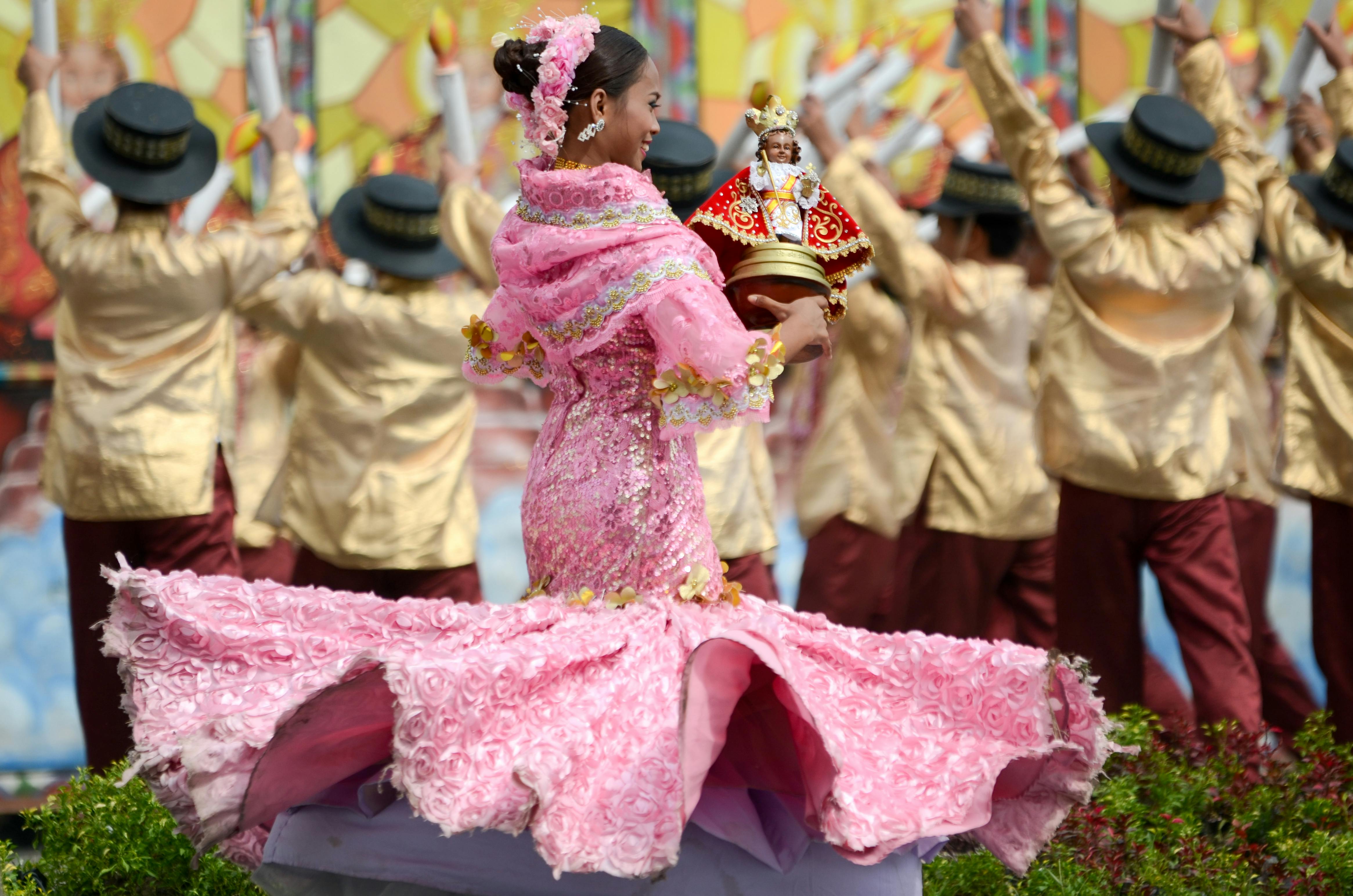 girl in pink dress dancing at Cebu cultural festival