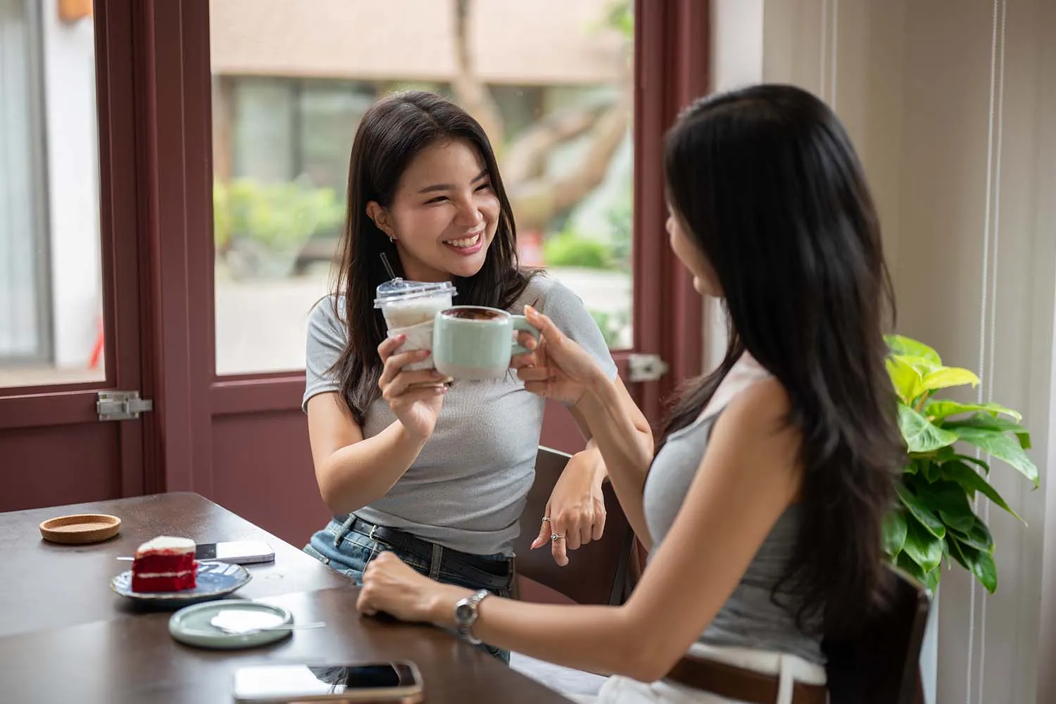 two girls enjoying coffee together