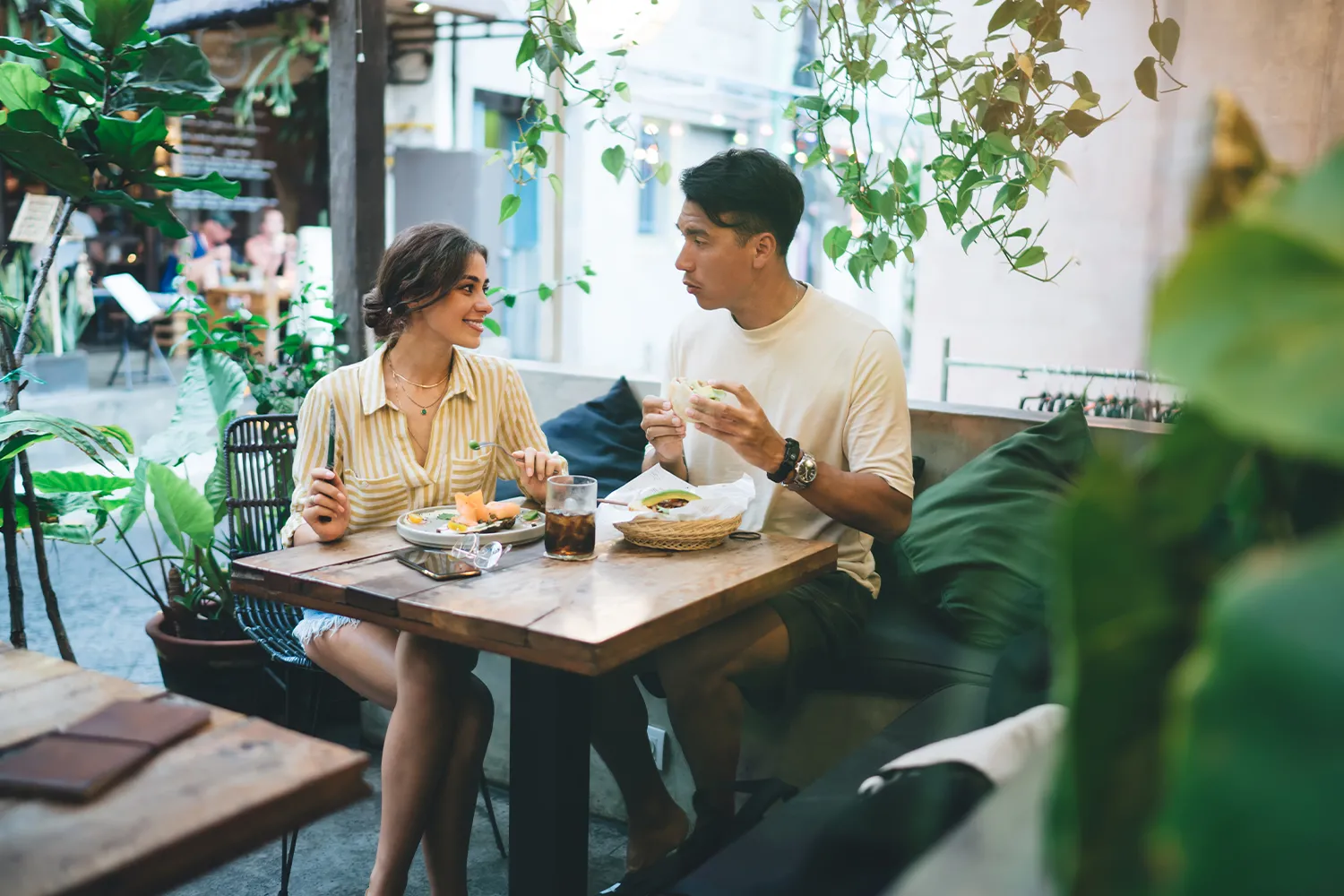 young couple having lunch at a cafe