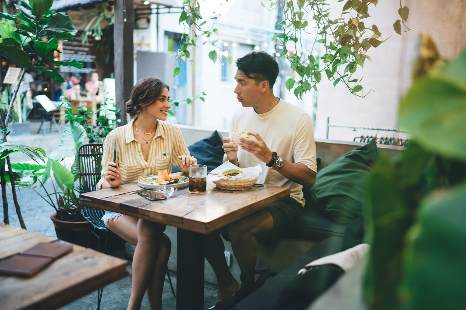 young couple having lunch at a cafe